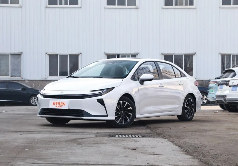2026 Toyota Corolla white sedan front three - quarter view in parking lot