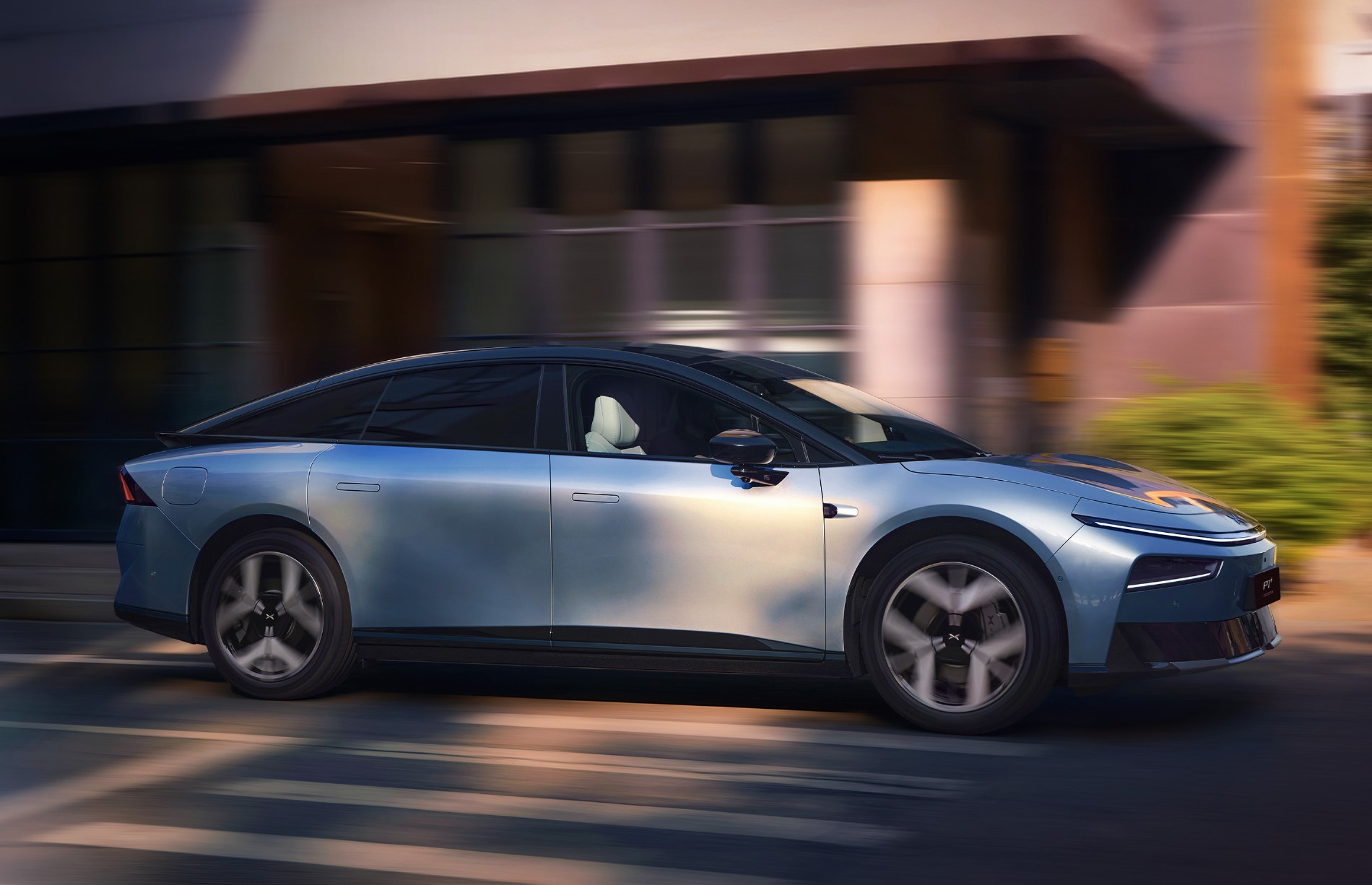 Xpeng P7+ side view in motion