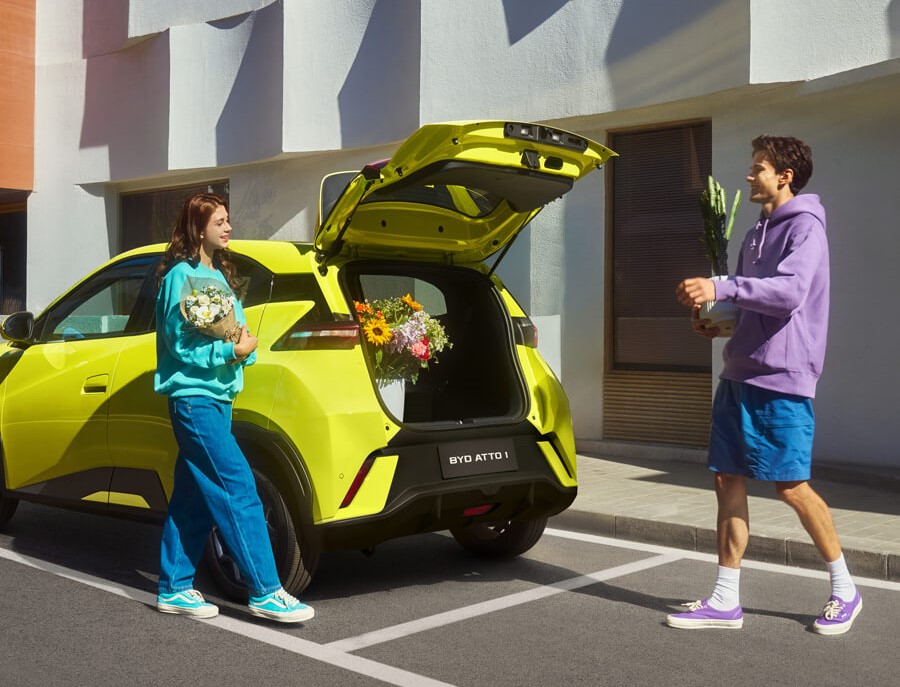 BYD ATTO 1 trunk with flowers in urban setting